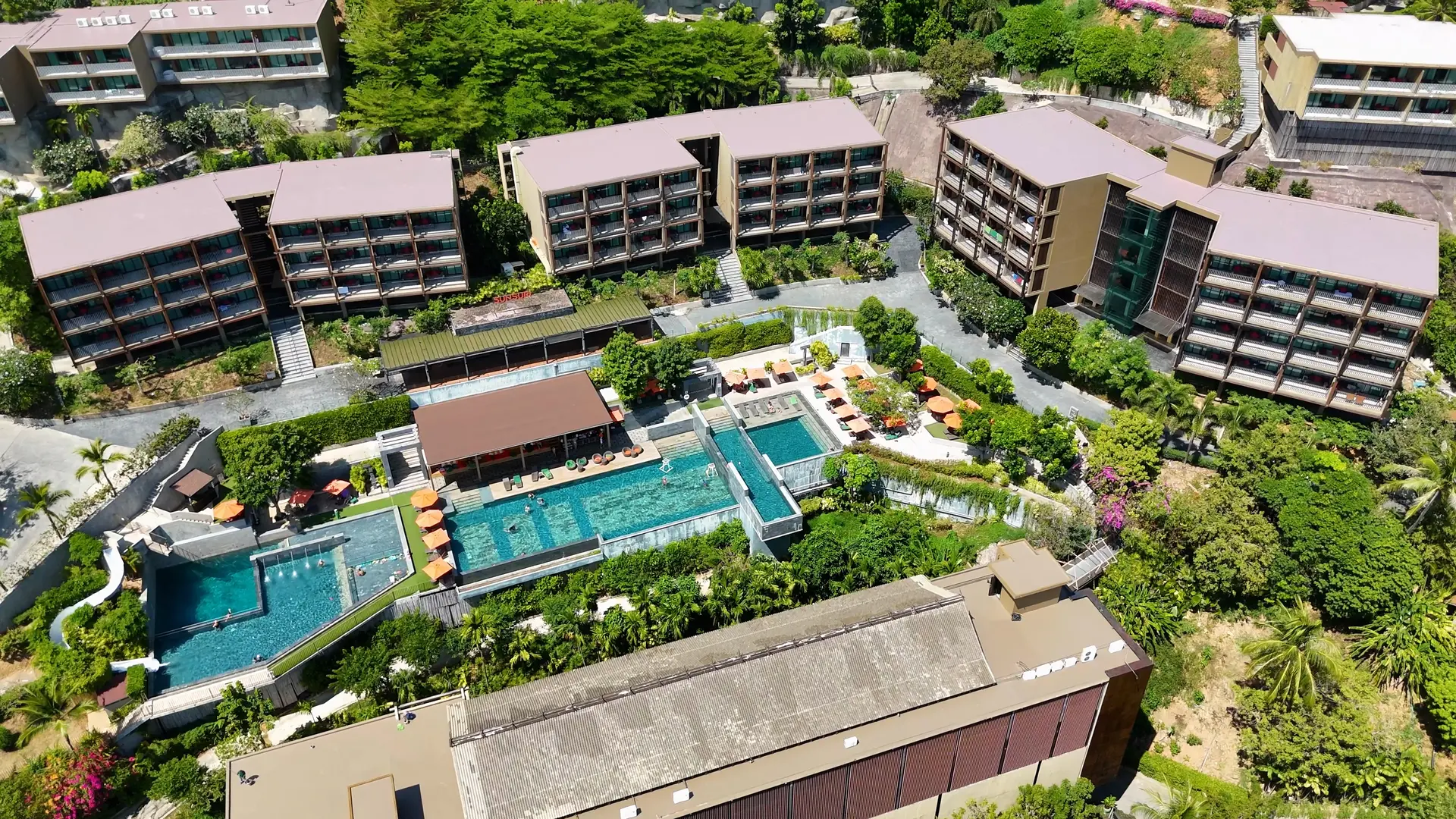 Professionally maintained hillside landscape with terraced plantings and stone walkways